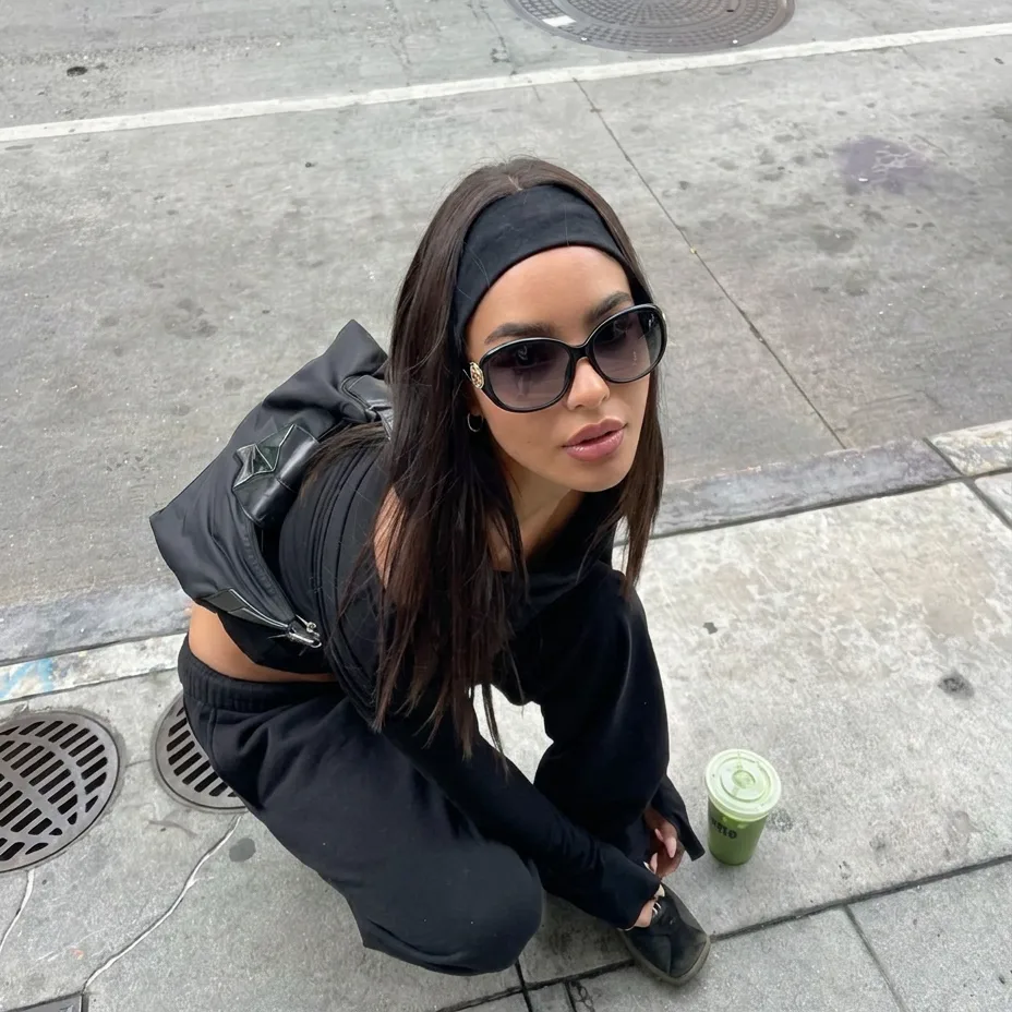 Bold Black Blue oversized oval sunglasses on model