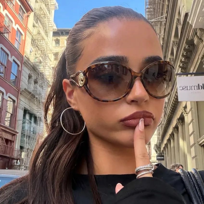 Bold Tortoise Brown oversized oval sunglasses on model