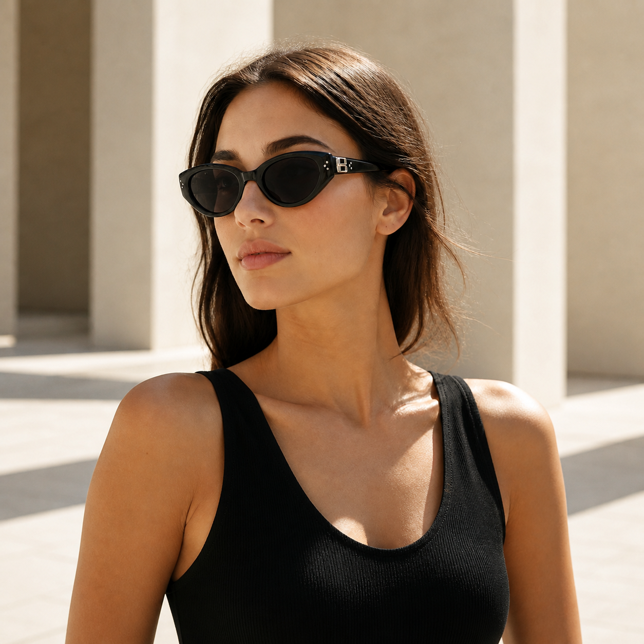 Celeste black cat eye sunglasses worn by a model