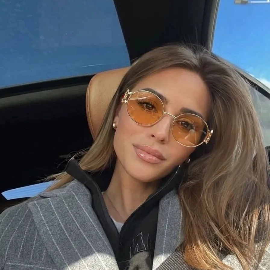 Eos Gold Peach round metal sunglasses on model