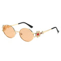 Eos round metal sunglasses in Gold Peach