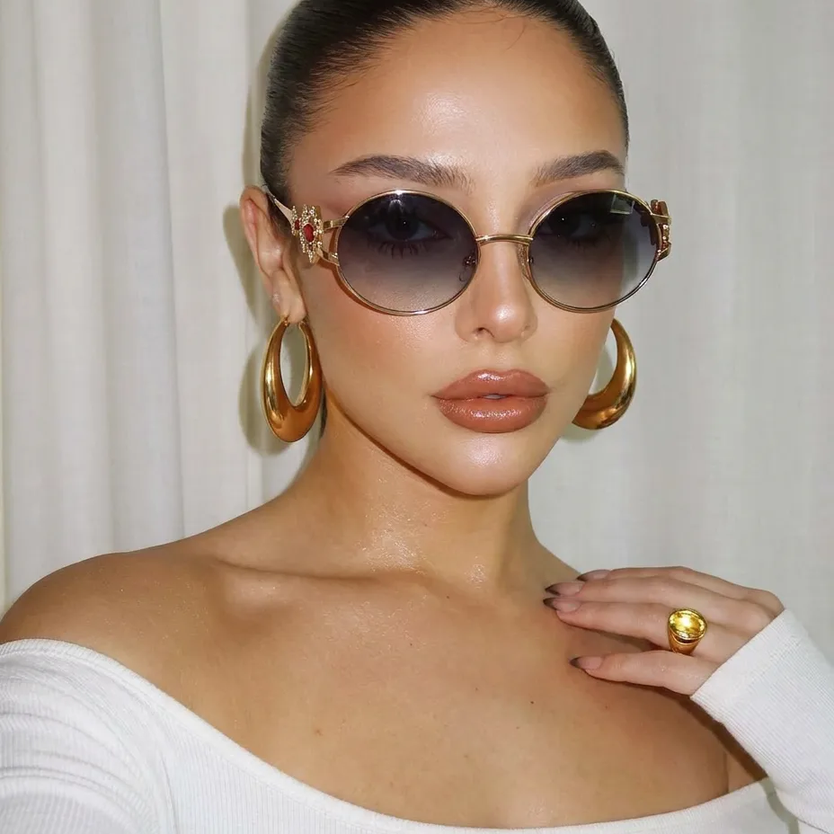 Eos Gold Smoke round metal sunglasses on model