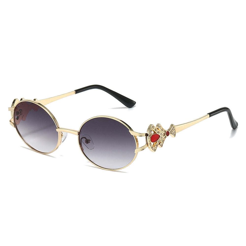 Eos round metal sunglasses in Gold Smoke