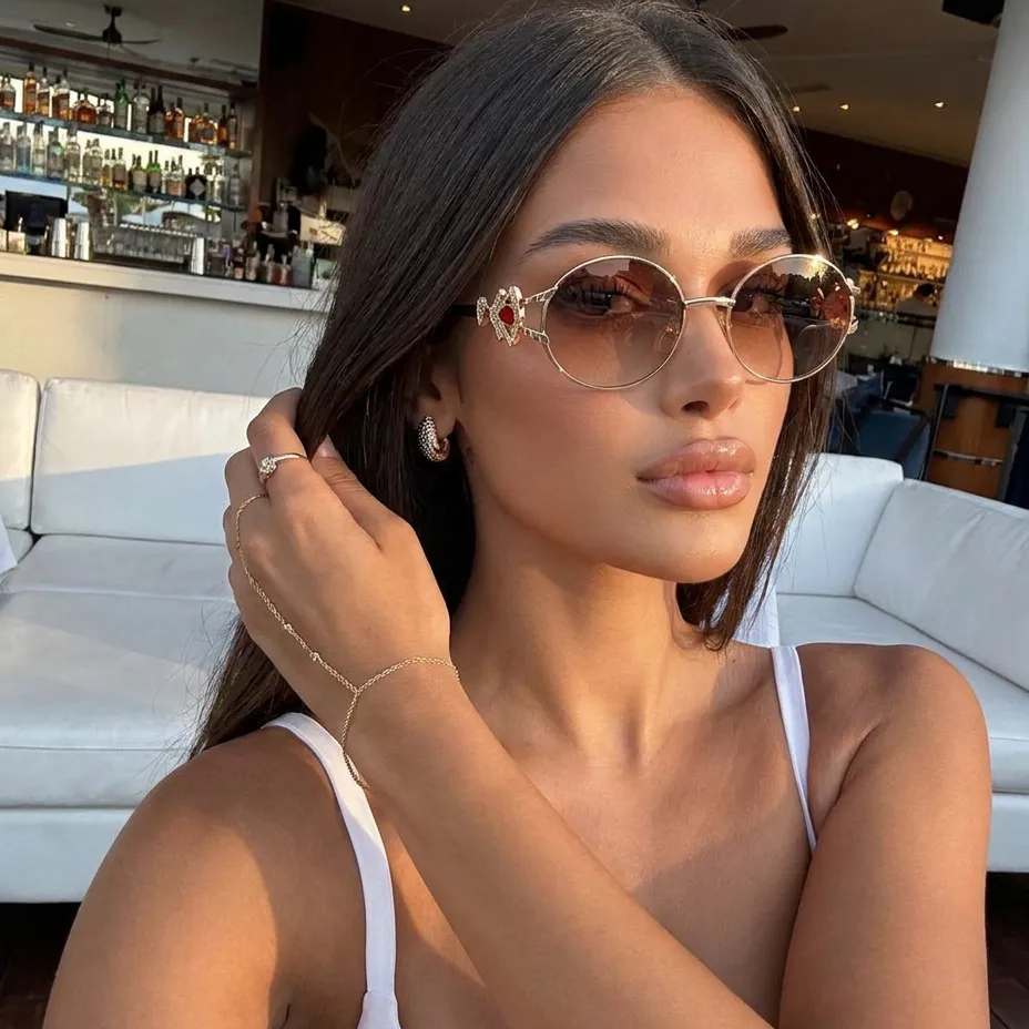 Eos Gold Brown round metal sunglasses on model
