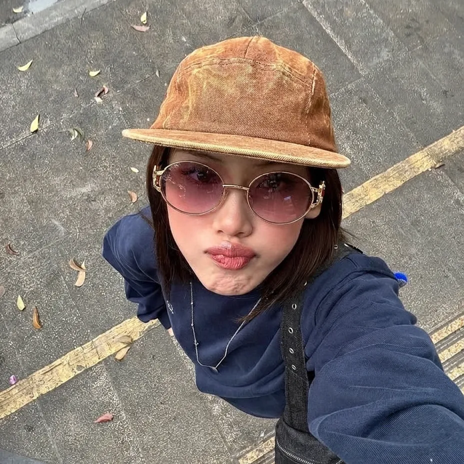 Eos Gold Violet round metal sunglasses on model
