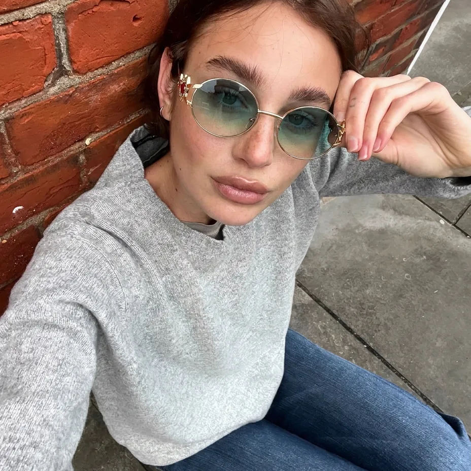 Eos Gold Blue round metal sunglasses on model
