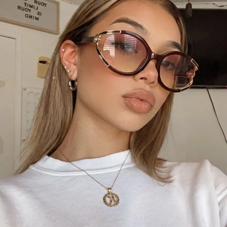Flare Deep Brown Pink cat-eye sunglasses on model