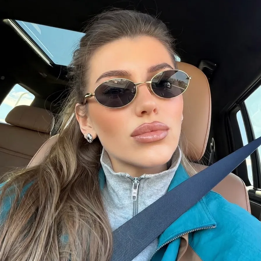 Kael Gold Black oval metal sunglasses on model