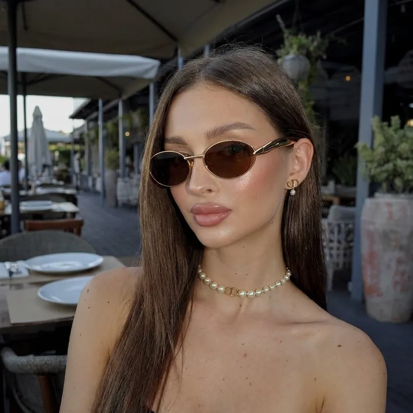 Kael Gold Pink oval metal sunglasses on model