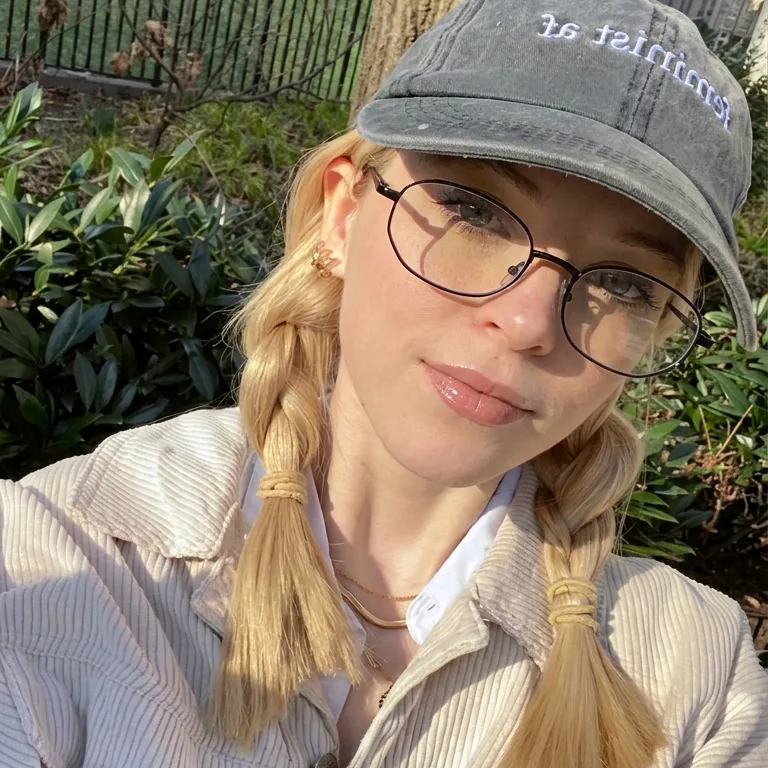 Iris black metal frame eyewear with clear lenses worn by a model