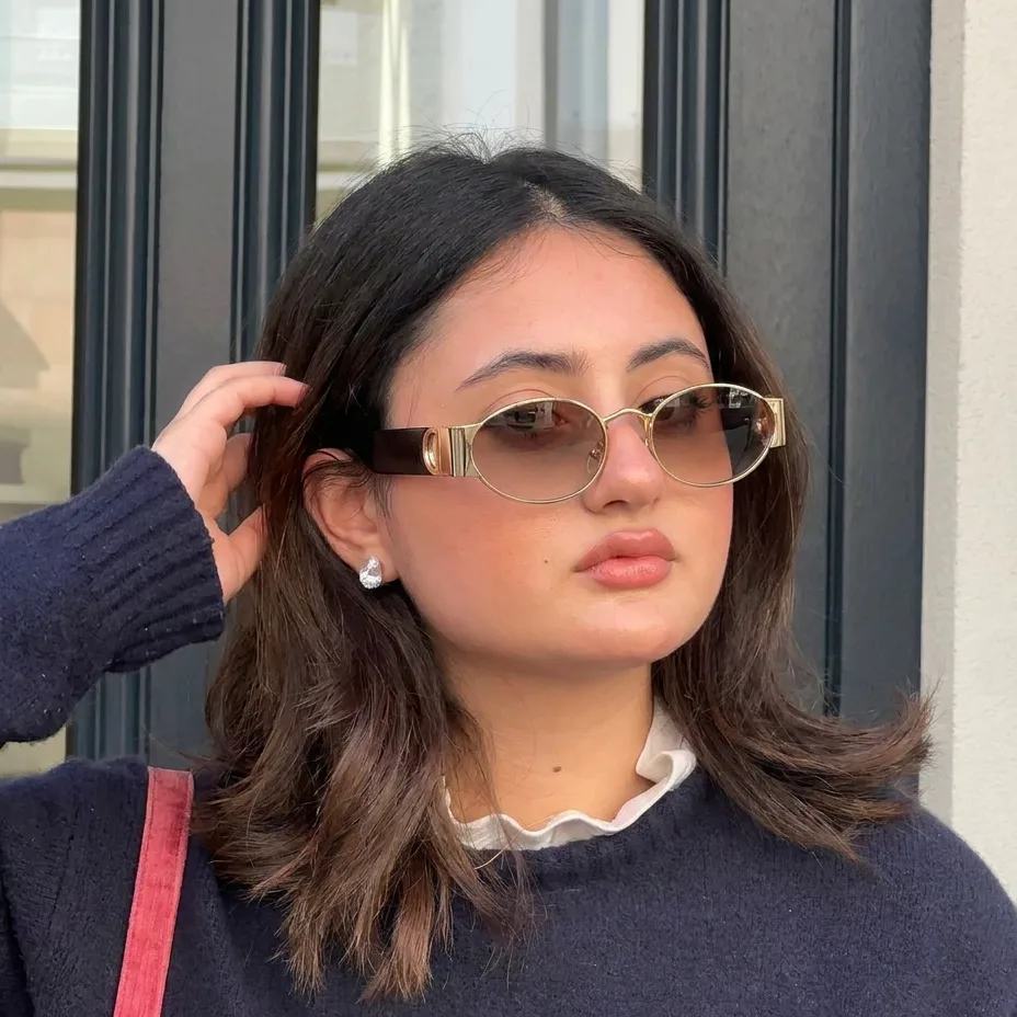 Zephyr Gold Blush oval sunglasses on model